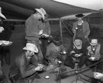 Cowboy eating at chuck wagon on Spur Ranch