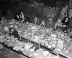 Scene at the Pioneer Palace where volunteers pack Goodfellow Christmas bags, 12/21/1937