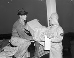 Robert Vaughn of Cameron County and Eudell May help deliver Goodfellows' Christmas bags, 12/22/1937