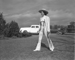Faye Kirkwood, rodeo performer, dressed in white cowgirl outfit