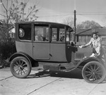 Mrs. J. C. Baker with her "Model T"