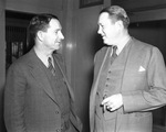Winfield Scott of Fort Worth (right) surrenders to Sheriff Carter on charges of contempt of Dallas district court for failing to make alimony payments