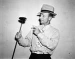 Clarence (Skeet) Fincher, manager and pro golfer at Z. Boaz golf course shows off a streamlined golf club