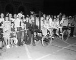 Crowds gather at Santa Fe railway depot to greet President Franklin D. Roosevelt on his third visit to Fort Worth, 07/10/1938