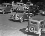 Automobiles photographed on a city street, 07/11/1938