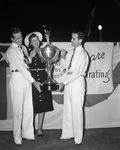Pat, Mike, and Molly O'Daniel hold the loving cup which was presented to their father, Governor-elect O'Daniel, at National Salesmen's Crusade rally at TCU Stadium