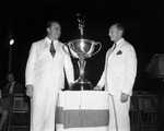 W. Bedford Brown (right), general chairman of Fort Worth's Division of the National Salesmen's Crusade, presents Governor-elect W. Lee O'Daniel with trophy for being Texas No. 1 Salesman of 1938