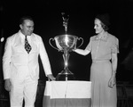 Governor-elect W. Lee O'Daniel and his wife with trophy for being Texas No. 1 Salesman of 1938