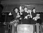 Casa Manana showgirls on back of train en route to New York on trip to London