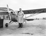 Johnny Jones, former vaudeville performer, shown with his midget plane