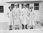 Carter family wearing matching overcoats and hats