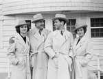Carter family wearing matching overcoats and hats