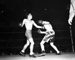 At the State Golden Gloves competition, Donald Harper fights Tommy Coates