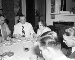 Enjoying dinner at the Texas Governor's mansion, from left, E. Blumagen of Oklahoma, Texas Governor-elect W. Lee O'Daniel, and Mrs. James V. Allred, 08/1938