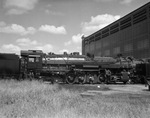 Texas and Pacific Railroad; "Iron Horse" locomotive next to Fort Worth T&P roundhouse