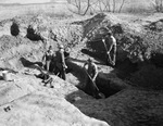 Excavation crew at work on digging up skeletons and traces of an early race of people by Frank Reeves Sr.