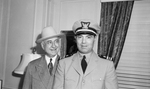 Amon Carter Senior, left and Naval officers