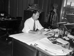 Amon Carter, Jr., at his desk