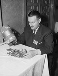 Doctor A. I. Goldberg, counting savings of Civitan Club