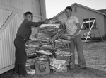 Harold Wayland (left) and Bobby Lee Lindsey with a stack of old papers
