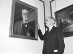 Doctor L. R. Scarborough looking at painting of Doctor J. B. Gambrell