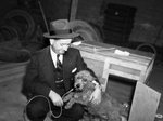 Tom E. Popplewell, with dog "Red"
