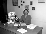 Mrs. Will K. Stripling, Red Cross worker, shown at her desk
