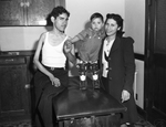 Polio patient Ernest Garcia, Richard Alvarado, 2, and Mrs. Treno Alvarado.