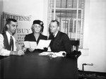 Mr. and Mrs. Joe F. Stout buying defense bonds