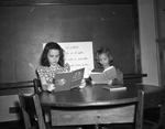 Lois Cartwright, left, and Patricia Ann roberts, studying Spanish