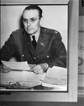 Major J.M. McGinley at his desk