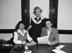 Louise Nelson, seated right, artist Sallie Gillespie, left, and Mrs. Flossie Kysar, standing