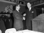 Marion Hicks, right, receiving award from Dr. Charles H. McCollum Junior