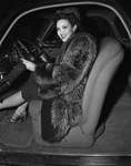 Linda Darnell at the wheel of her car