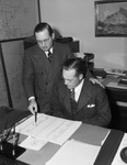 C. H. Bartlett, left, district manager of Safeway Stores, talking to his successor, W. E. Williams of Abilene, Texas.