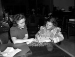 Norma Ruth Wisdom buying a defense bond