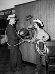Betty Bowman, "ranch girl" roping Charles G. Cotten