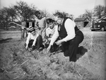 George Kreyenbuhl, showing Saint Teresa's Home boys how to plant onions
