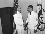Lieutenant Commander Victor F. Tydlacka (left) and Chief Yoeman P. W. Fischer