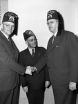 Thomas C. Law, (right) Atlanta, Georgia being greeted by J. P. Tarry, (left) Wichita Falls, Texas and Jack McGraw, Fort Worth, Texas