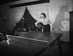 Mrs. Reed Sass playing ping-pong