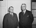 Fred R. Cotten (left) of Weatherford, Texas, retiring president of Texas Swine Breeders Association, and W. T. Reneker of Chicago, Illinois