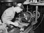 North Texas Agricultural College (N. T. A. C.) wartime efforts include David Bothwell learning how to use a lathe at the Lake Worth Bomber Plant