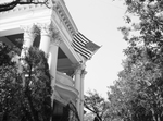 Flag flying in front entrance to J. Roby Penn home