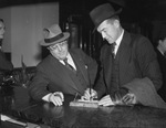 Bob Linton and J. Walter Morris are checking in at headquarters of Texas League