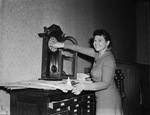 Mrs. Randall C. Wilson winding the courthouse clock