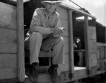 Earl E. Johnson, 27, of Pittsburg, Texas, sitting in back of his truck