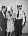 Dorothy Lamour (center) in Fort Worth with Johnny Monaghan (left) and Captain McMahon