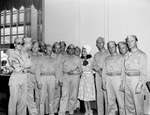 Dorothy Lamour and a group of soldiers at Hotel Texas for a war bond drive