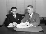 Texas State Office of Price Administration director Mark McGee, right, and Samuel M. Ray, representative of U. S. Civil Service Commissiom